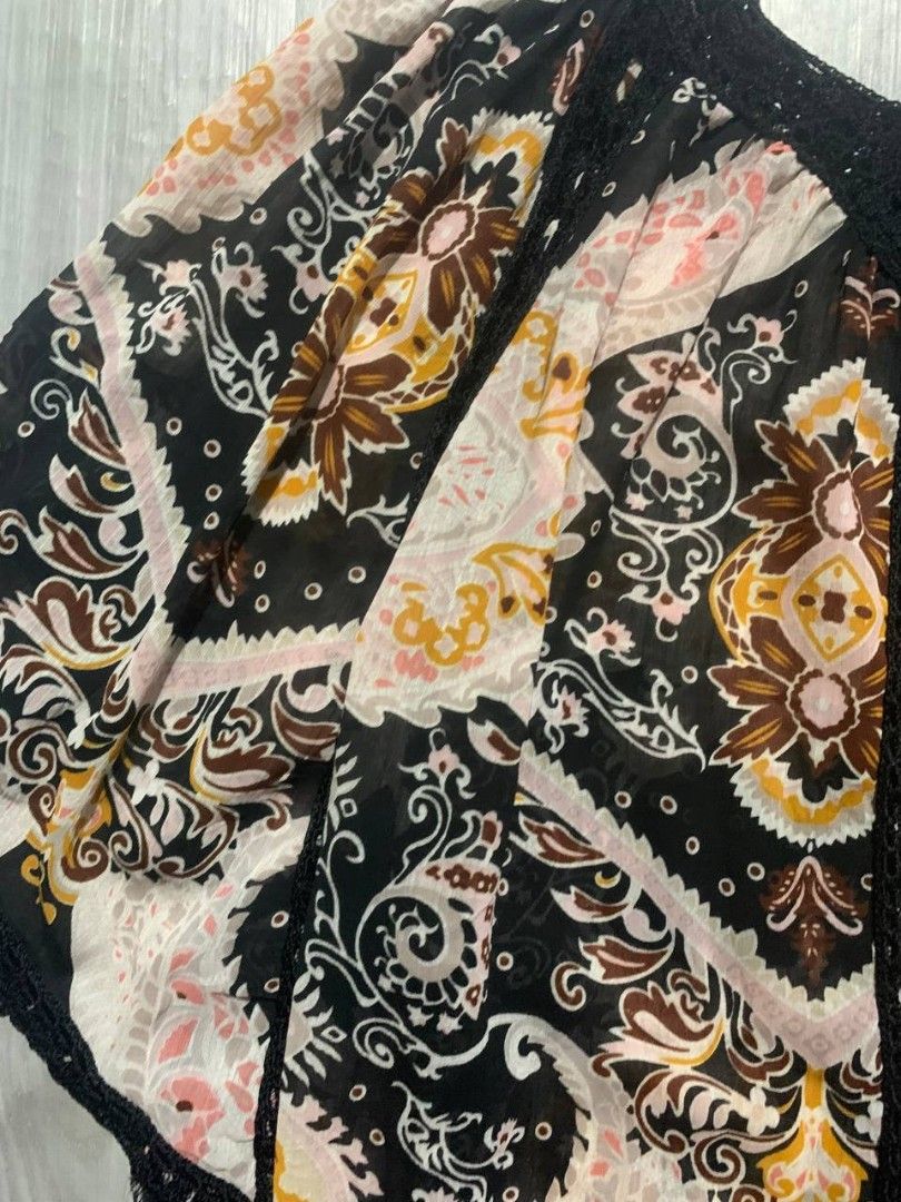 Boho Paisley Print Off-Shoulder Top (Category: Blouses) located in Las Pinas. Submitted by blitzycloth (Listing ID 1438995999, Image 3). Description: Boho off-shoulder top with paisley print. Features crochet neckline and detailing. Relaxed fit, perfect for casual wear..