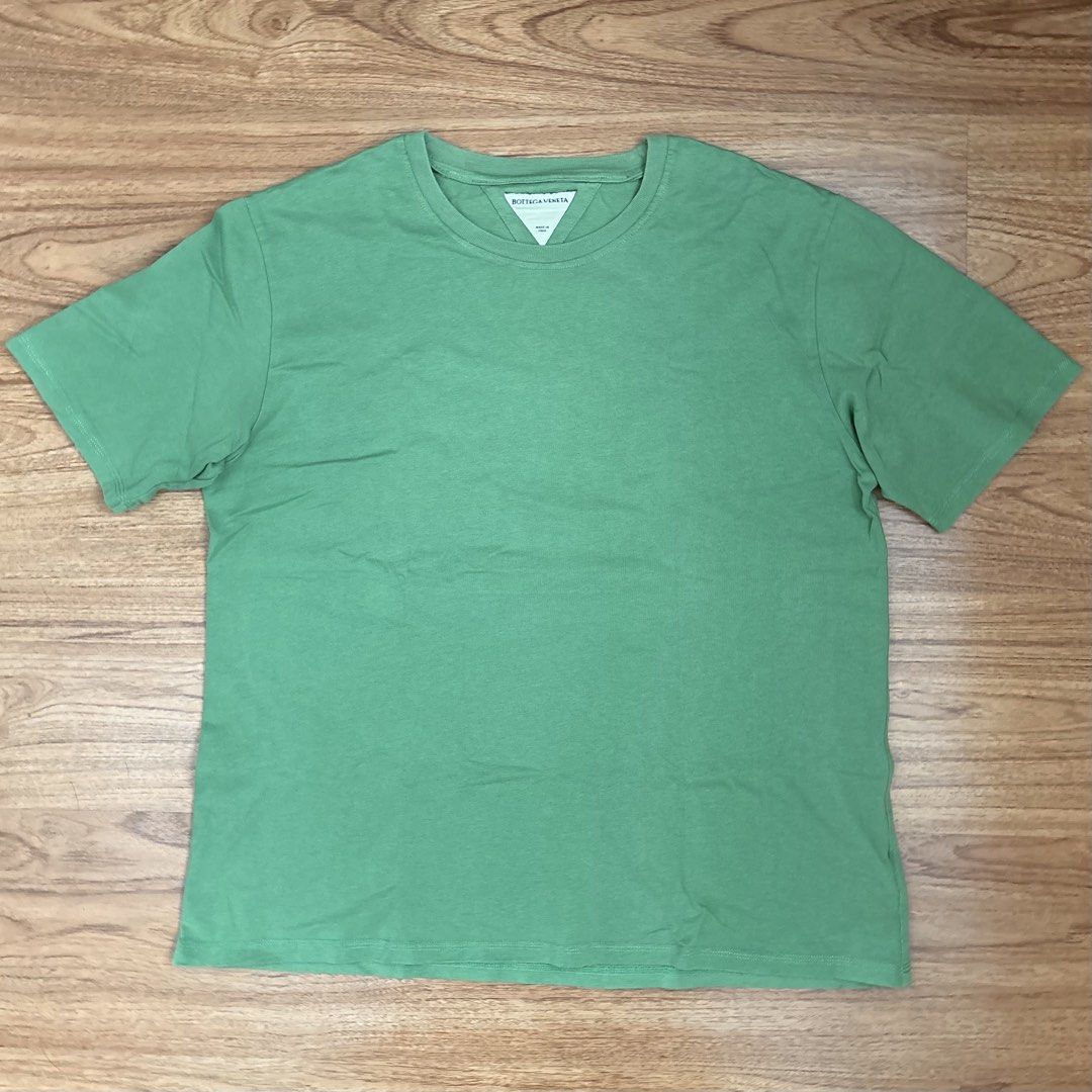 Bottega Veneta Green Cotton Tee (Category: Tshirts & Polo Shirts ) located in Taguig. Submitted by mariow (Listing ID 1438977020, Image 2). Description: Thrifted, source unknown 22 in x 27 in Neck tag and wash tags present - Green Bottega Veneta Cotton T-shirt. - Features a crew neck and short sleeves. - Necktag present - Subtle embroidered logo on the back..