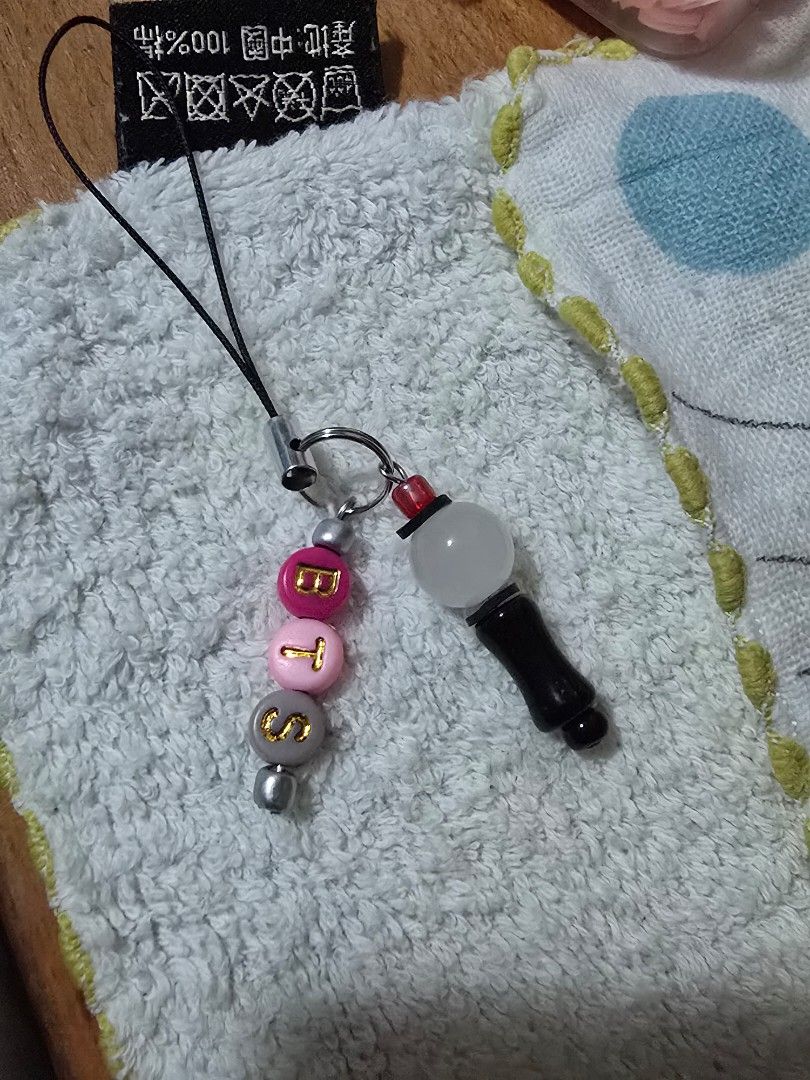 BTS Lightstick Keychain (Category: K-Wave) located in Singapore. Submitted by plxiah (Listing ID 1439010360, Image 1). Description: - BTS lightstick keychain (handmade by me) - Features 'BTS' bead design - Perfect for ARMY members - Great for bags or collections - Excellent gift idea.