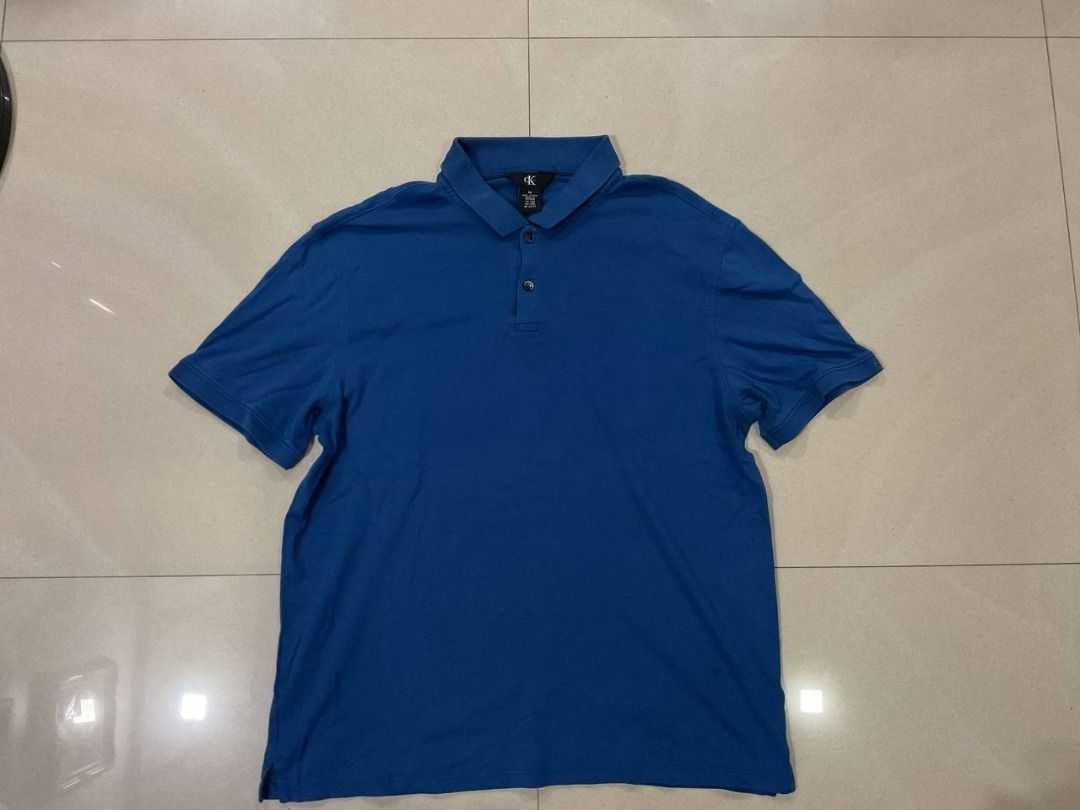 Calvin Klein Polo Shirt - Blue - Medium (Category: Tshirts & Polo Shirts ) located in Manila. Submitted by okeanos (Listing ID 1438946829, Image 1). Description: 💙🔥 Calvin Klein Essential Polo 🔥💙 Classic Calvin Klein essential with clean minimalist look. Easy to style everyday premium piece. 📏 Best fits Medium - Large 🎨 Color: Royal Blue 🧵 Stretch comfortable fabric ⭐ Condition: 9/10 Excellent pre-loved • No major flaws • Ready to wear 💸 
