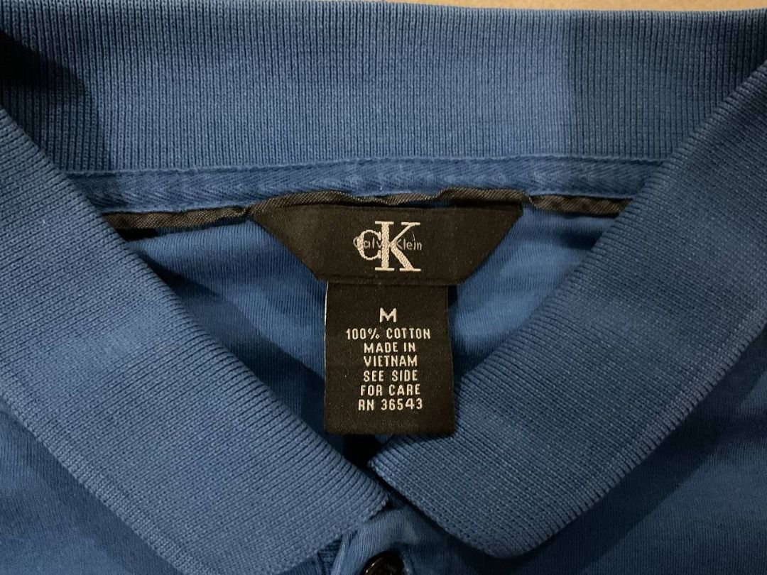 Calvin Klein Polo Shirt - Blue - Medium (Category: Tshirts & Polo Shirts ) located in Manila. Submitted by okeanos (Listing ID 1438946829, Image 3). Description: 💙🔥 Calvin Klein Essential Polo 🔥💙 Classic Calvin Klein essential with clean minimalist look. Easy to style everyday premium piece. 📏 Best fits Medium - Large 🎨 Color: Royal Blue 🧵 Stretch comfortable fabric ⭐ Condition: 9/10 Excellent pre-loved • No major flaws • Ready to wear 💸 