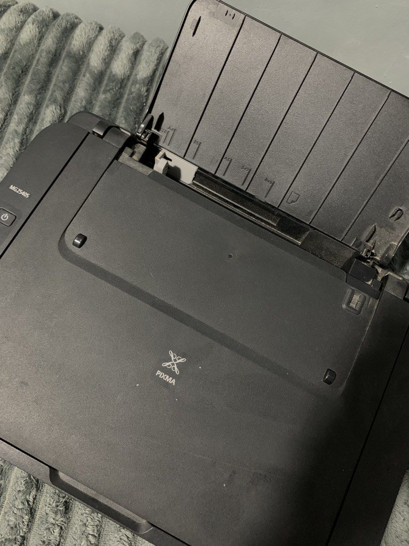 Canon PIXMA MG2545S Printer (Category: Printers, Scanners & Copiers) located in Cavite. Submitted by glockeyes (Listing ID 1439022315, Image 3). Description: - Canon PIXMA MG2545S printer - In good working condition - Features a scanner - Includes a paper tray - Model number visible - Sleek black design .