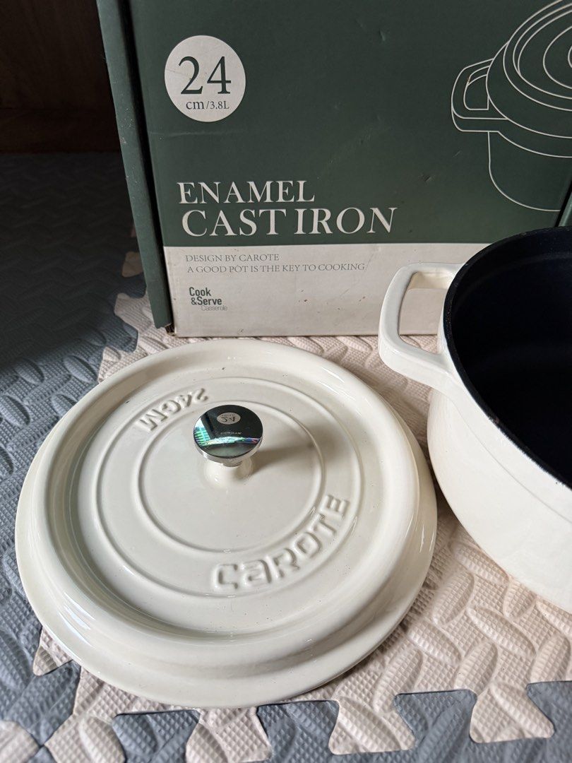 Carote 24cm Enamel Cast Iron Pot (Category: Cookware & Accessories) located in Quezon City. Submitted by eckaaatxn (Listing ID 1438960125, Image 2). Description: - Carote 24cm Enamel Cast Iron Pot - Cream exterior, black interior - Includes matching lid - Designed by Carote - Suitable for cooking and serving.