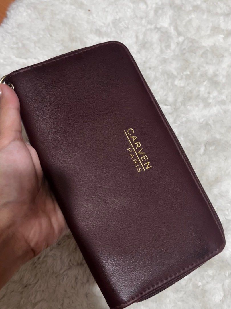Carven Paris Wristlet Wallet (Category: Wallets & Card holders) located in Las Pinas. Submitted by ameothings (Listing ID 1439037806, Image 1). Description: please manage your expectations, this item has flaws as seen on pic. the issue of the leather itself— barely noticeable. the wristlet chain could be removed and change it as a wallet color: maroon dm if interested!.
