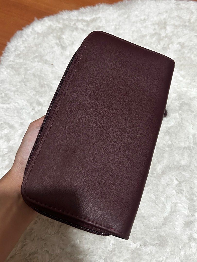 Carven Paris Wristlet Wallet (Category: Wallets & Card holders) located in Las Pinas. Submitted by ameothings (Listing ID 1439037806, Image 2). Description: please manage your expectations, this item has flaws as seen on pic. the issue of the leather itself— barely noticeable. the wristlet chain could be removed and change it as a wallet color: maroon dm if interested!.