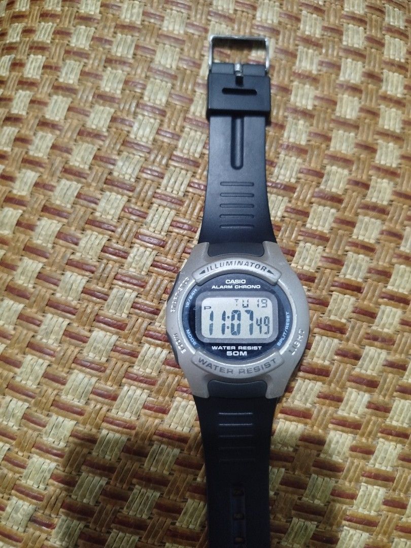 Casio Alarm Chrono Digital Watch (Category: Men's Watches) located in Subic. Submitted by regiedaniel01 (Listing ID 1438903709, Image 1). Description: - Casio digital watch - Alarm and Chrono functions - Illuminator backlight - Water resistant to 50 meters - Displays time, day, and date - Black strap - Silver-colored bezel - Stainless steel back.