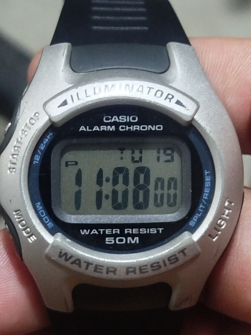 Casio Alarm Chrono Digital Watch (Category: Men's Watches) located in Subic. Submitted by regiedaniel01 (Listing ID 1438903709, Image 2). Description: - Casio digital watch - Alarm and Chrono functions - Illuminator backlight - Water resistant to 50 meters - Displays time, day, and date - Black strap - Silver-colored bezel - Stainless steel back.