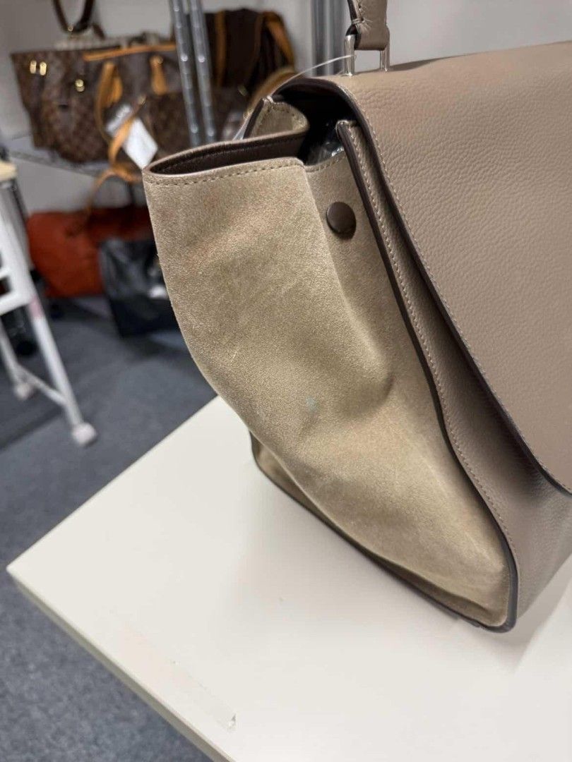 Celine Trapeze Handbag (Category: Luxury Bags & Wallets) located in Paranaque City. Submitted by 606wuwtrading (Listing ID 1438995228, Image 2). Description: Large Celine Trapeze handbag in a neutral color. Features a flap closure, top handle, and back zipper pocket. Made with leather and suede. Sourced in Japan.