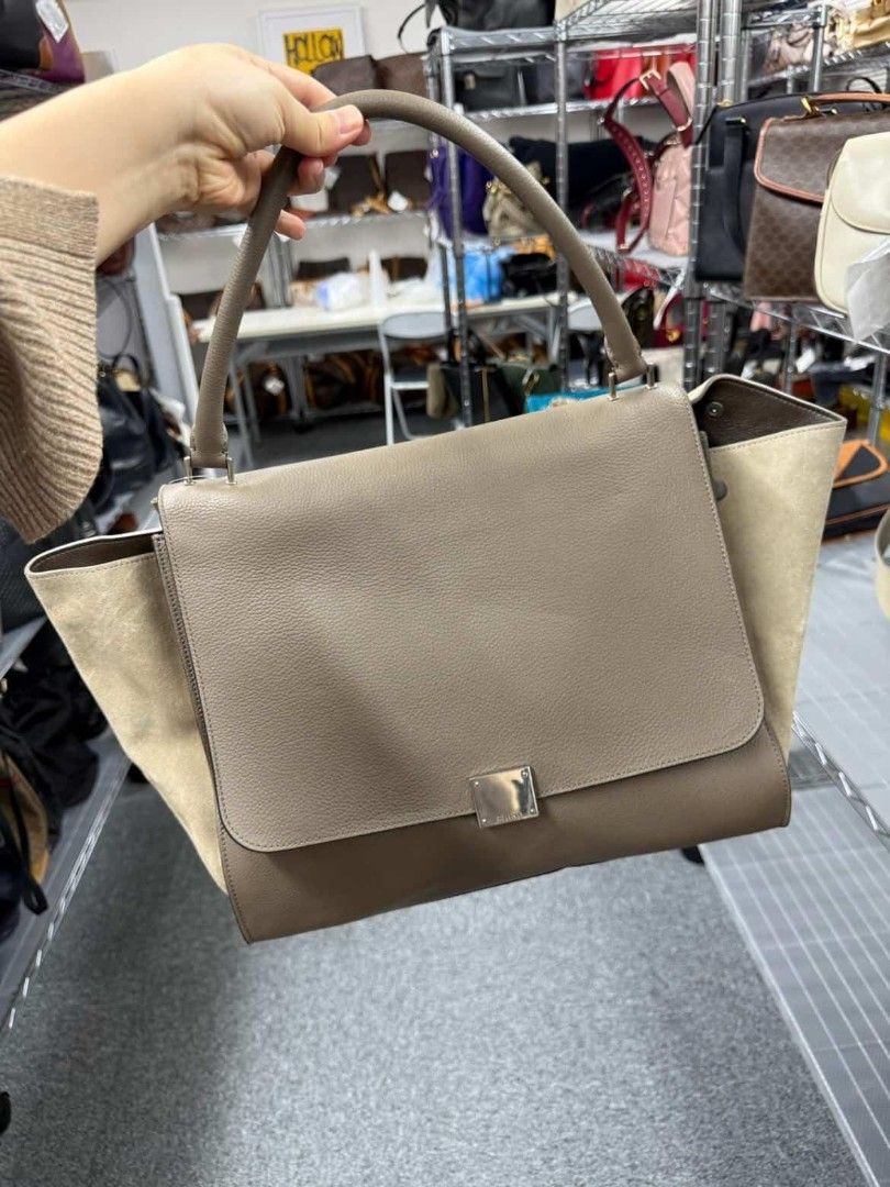 Celine Trapeze Handbag (Category: Luxury Bags & Wallets) located in Paranaque City. Submitted by 606wuwtrading (Listing ID 1438995228, Image 1). Description: Large Celine Trapeze handbag in a neutral color. Features a flap closure, top handle, and back zipper pocket. Made with leather and suede. Sourced in Japan.
