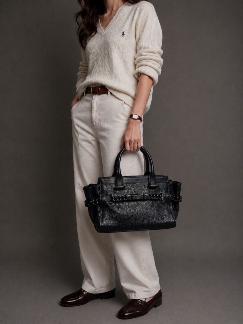 COACH SWAGGER (ALL-BLACK EDITION) (Category: Luxury Bags & Wallets) located in Baguio. Submitted by PreiLoveMaria (Listing ID 1438980361, Image 1). Description: COACH SWAGGER (ALL-BLACK EDITION) 🖤 features beautiful pebbled leather paired with sleek, matte black hardware and woven chain details. ​DETAILS: ​Material: Premium pebbled leather with smooth leather trim ​Hardware: Matte black "triple black" hardware with iconic double turn locks and Y