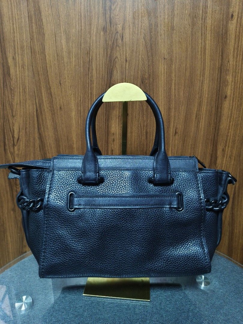 COACH SWAGGER (ALL-BLACK EDITION) (Category: Luxury Bags & Wallets) located in Baguio. Submitted by PreiLoveMaria (Listing ID 1438980361, Image 3). Description: COACH SWAGGER (ALL-BLACK EDITION) 🖤 features beautiful pebbled leather paired with sleek, matte black hardware and woven chain details. ​DETAILS: ​Material: Premium pebbled leather with smooth leather trim ​Hardware: Matte black "triple black" hardware with iconic double turn locks and Y