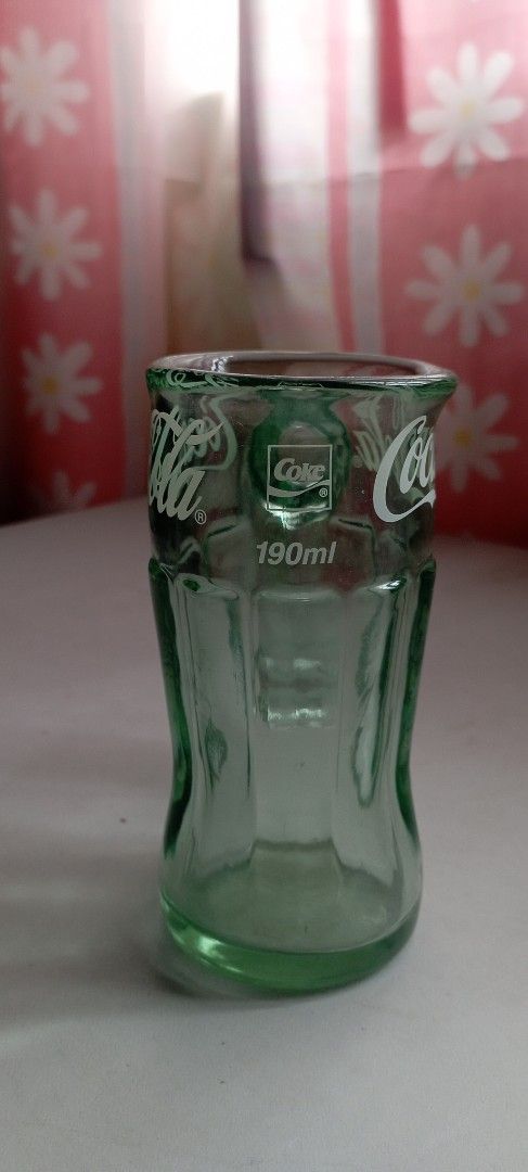 Coca-Cola Glass Mug 190ml (Category: Coffee & Tea Tableware) located in Manila. Submitted by cool_niacene15 (Listing ID 1438967565, Image 1). Description: - Vintage Coca-Cola mug - I bought this from a glass artist in Japan - Features the iconic Coca-Cola logo - Green-tinted glass - Includes a handle for easy use.