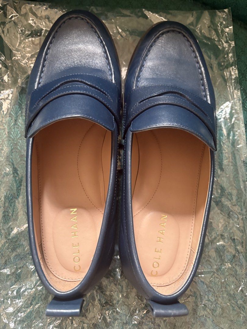 Cole Haan Leather Loafers (Size 7) (Category: Loafers) located in Antipolo. Submitted by theeditedcloset (Listing ID 1438924787, Image 2). Description: - Cole Haan leather loafers - Color: Navy blue - Classic penny loafer design - Smooth leather upper - Rounded toe - Low heel - Cole Haan logo on insole.