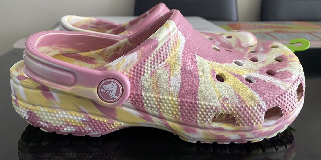 Crocs Classic Marbled Clog (Category: Slippers and slides) located in Mandaluyong City. Submitted by gabbie_0708 (Listing ID 1438891693, Image 3). Description: - Authentic Crocs Classic Marbled Clog - Size: 6 - Unique pink, yellow, and white marbled design - Bought in SM Megamall RFS: extra pair.