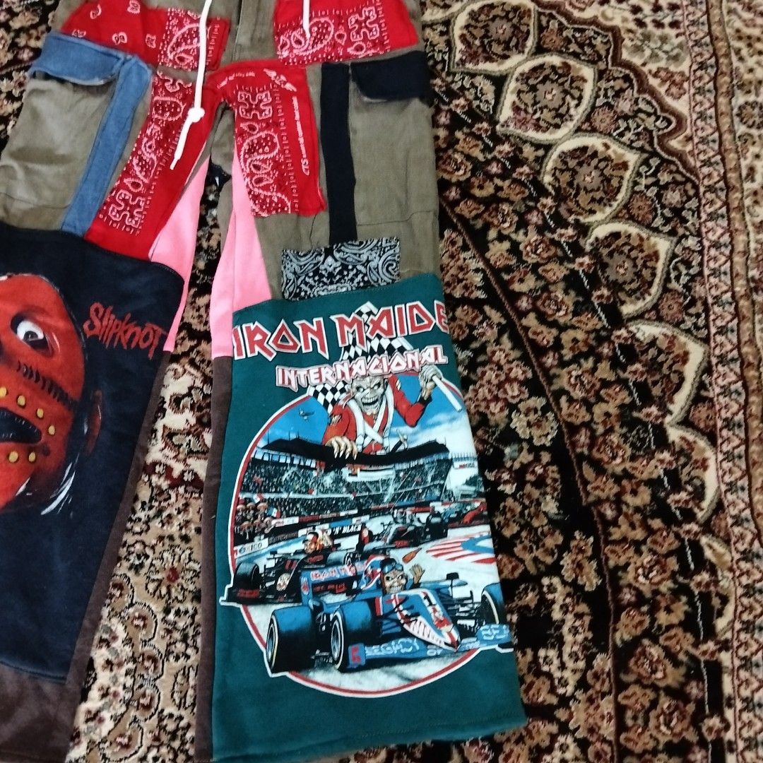 Custom Patchwork Cargo Pants (Category: Trousers) located in Besut. Submitted by fiercedog_72f048 (Listing ID 1439010115, Image 3). Description: - Custom-made cargo pants - Olive green base color - Unique patchwork design - Features patches from Slipknot and Iron Maiden band t-shirts, and red bandanas - Drawstring waist - Multiple pockets - One-of-a-kind design.