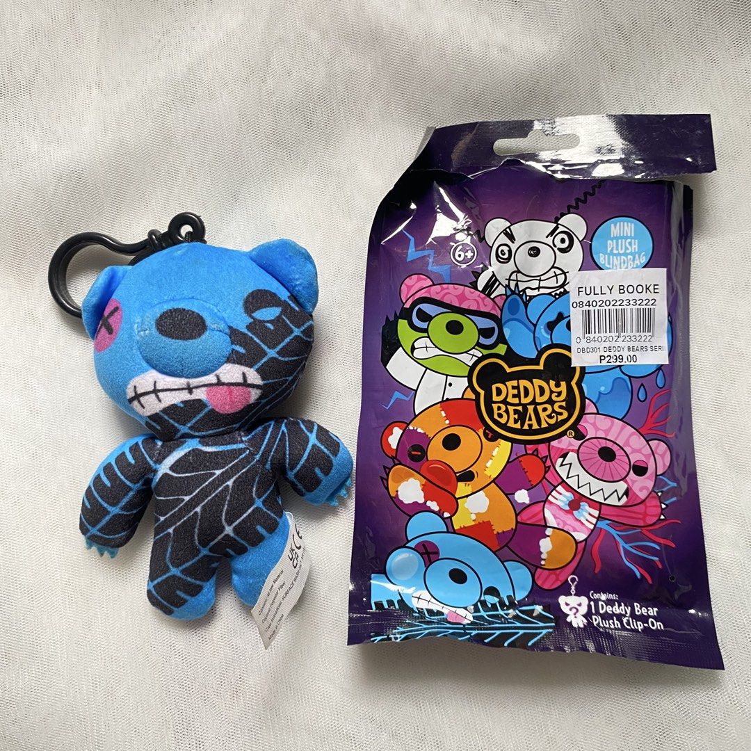 Deddy Bears Mini Plush Clip-On (Category: Plushies & Soft Toys) located in Makati City. Submitted by imsuli (Listing ID 1438928215, Image 1). Description: ෆ It features a blue bear with a unique design ෆ The plush comes with a clip for easy attachment ෆ The original price tag is still attached, showing a price of ₱299.00 ෆ It is a blind bag item.