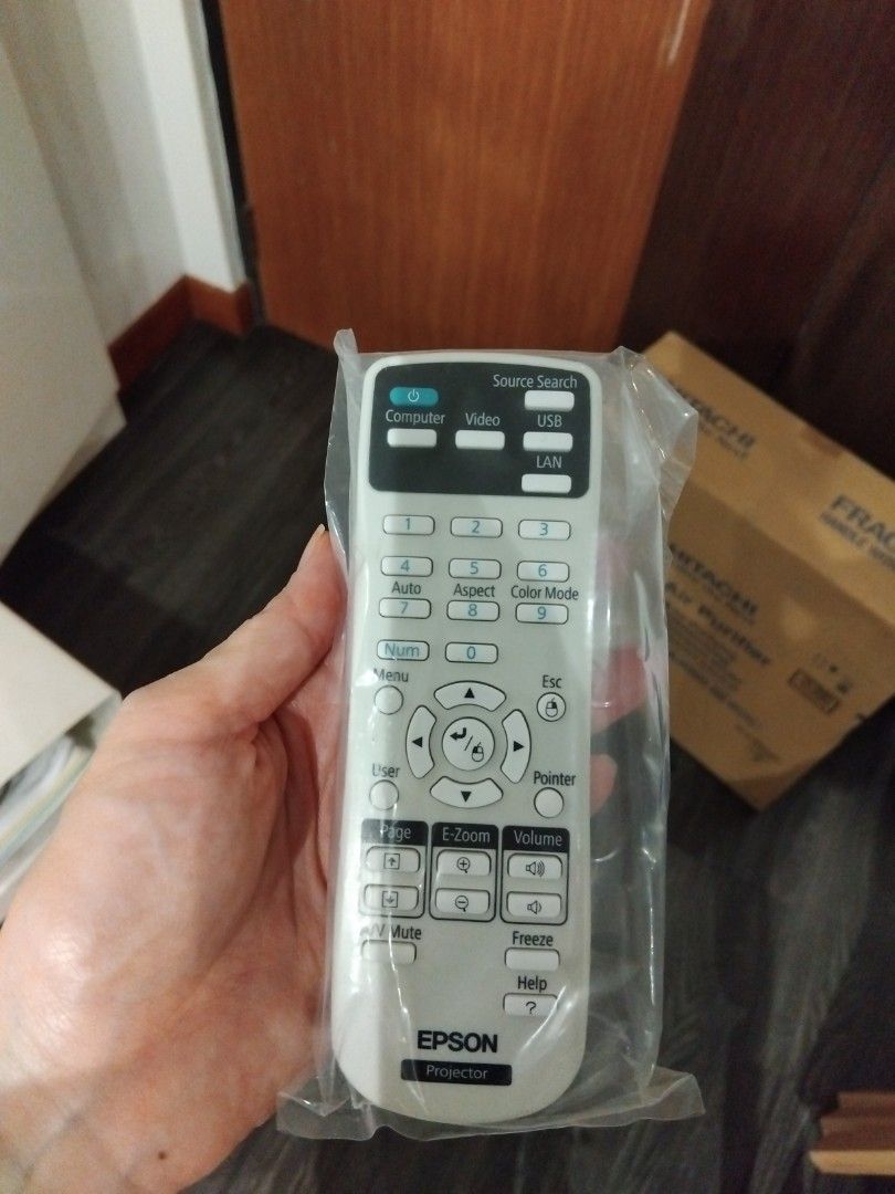 Epson Projector Remote Control (Category: Projectors) located in Singapore. Submitted by love2meetz_u (Listing ID 1439028655, Image 1). Description: - Genuine Epson projector remote control - Brand new, in original packaging - Features buttons for computer, video, USB, LAN, etc. - Designed for Epson projectors.