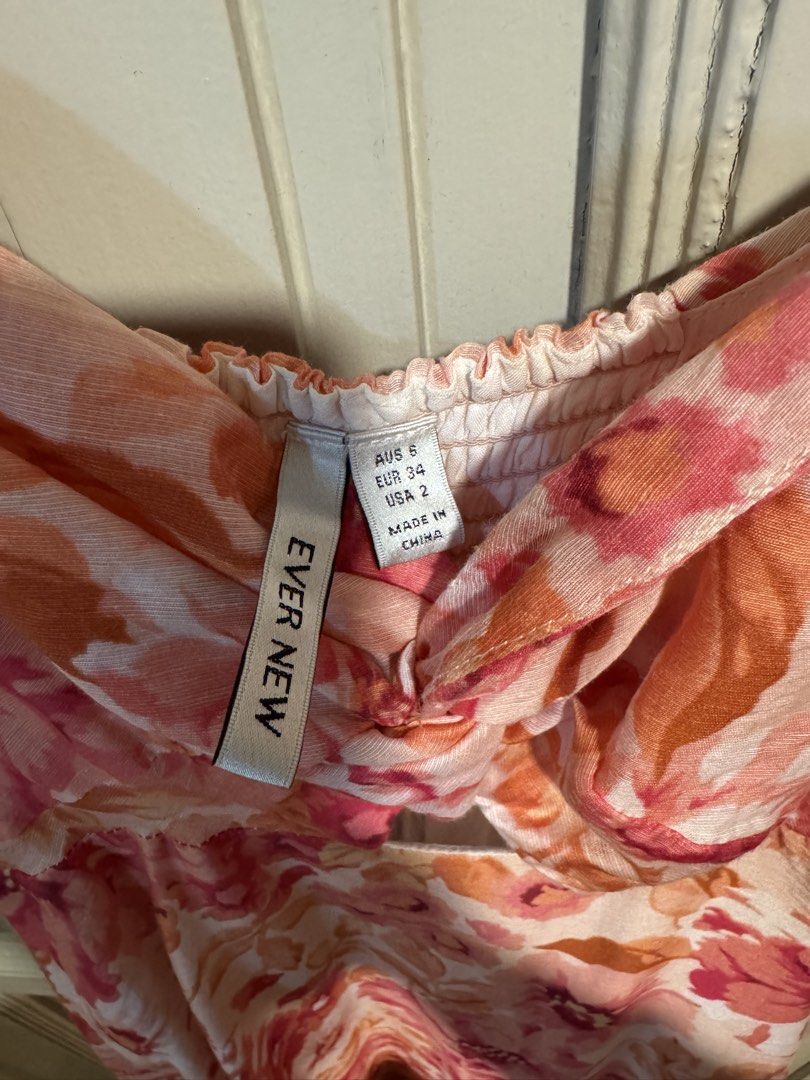 Ever New Floral Dress (Category: Dresses) located in Quezon City. Submitted by shoptillyoudrop777 (Listing ID 1439005916, Image 3). Description: - Ever New floral dress - Sweetheart neckline - Puff sleeves - Fitted bodice with a flowing skirt - Pink and orange floral pattern - Size: AUS 6, EUR 34, US 2 - Made in China.