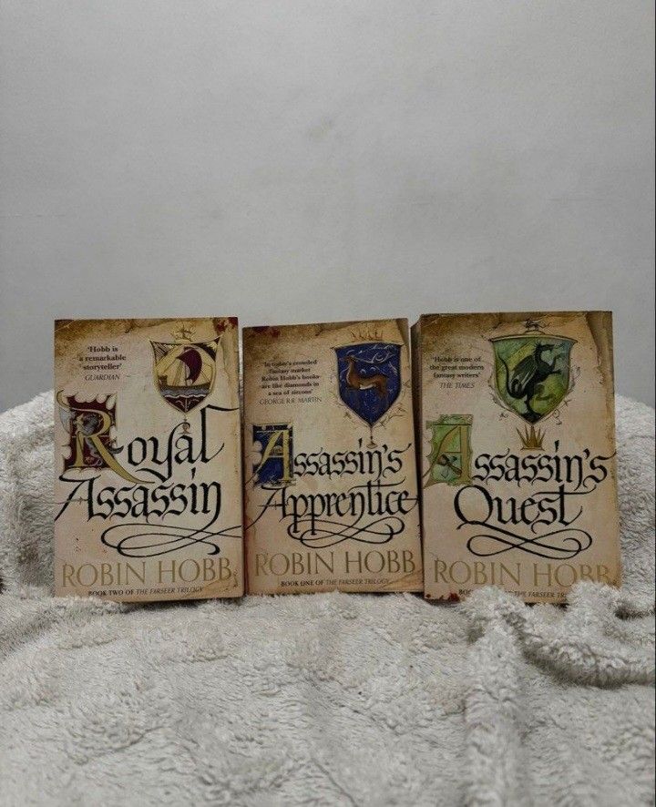 Farseer Trilogy by Robin Hobb (Category: Storybooks) located in Imus. Submitted by shelves_of_aaron (Listing ID 1439058568, Image 1). Description: Assassins Apprentice Royal Assassin Assassins Quest SOLD AS SET Has minimal shipping damage Shipping: J&T/Lalamove Mode of Payment: GCASH.