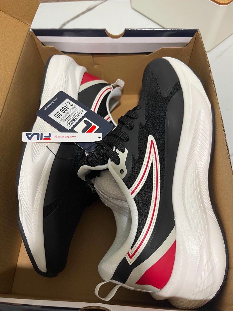 Fila Running Shoes Black White Red (Category: Sneakers) located in Quezon City. Submitted by thisispb (Listing ID 1438936768, Image 2). Description: Fila running shoes Black, White, and Red Size: UK 7, US 8, EUR 41 Comes with original box and tags - Mesh upper - Thick white sole - Red and white accents on the sides Negotiable 🤝.