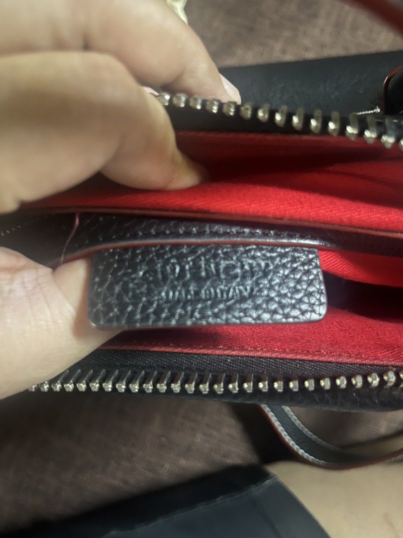 Givenchy (Category: Luxury Bags & Wallets) located in Quezon City. Submitted by retann (Listing ID 1438690942, Image 3). Description: - Antigona top stitch pebbled leather -thrifted in HK - Classic black color with white stitching and red accents - Features a top handle and a detachable shoulder strap for versatile carrying options - Givenchy logo prominently displayed - Secure zip closure - Crafted from luxurious, textured leather LP na.