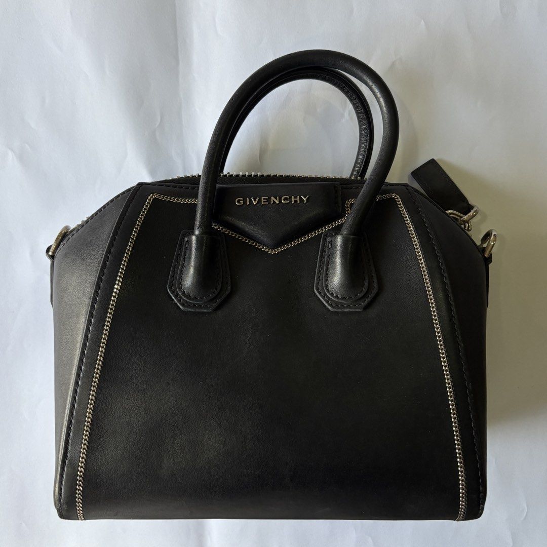 Givenchy Black Leather Mini Chain Embellished Antigona (Category: Luxury Bags & Wallets) located in Manila. Submitted by wintermelonmilktea2003 (Listing ID 1438981867, Image 1). Description: - Givenchy Antigona Mini Bag - Color: Black - Style: Mini - Features: - Top handle - Detachable shoulder strap - Silver-tone hardware - Zip closure - Material: 100% Calf Leather - Includes original tag.