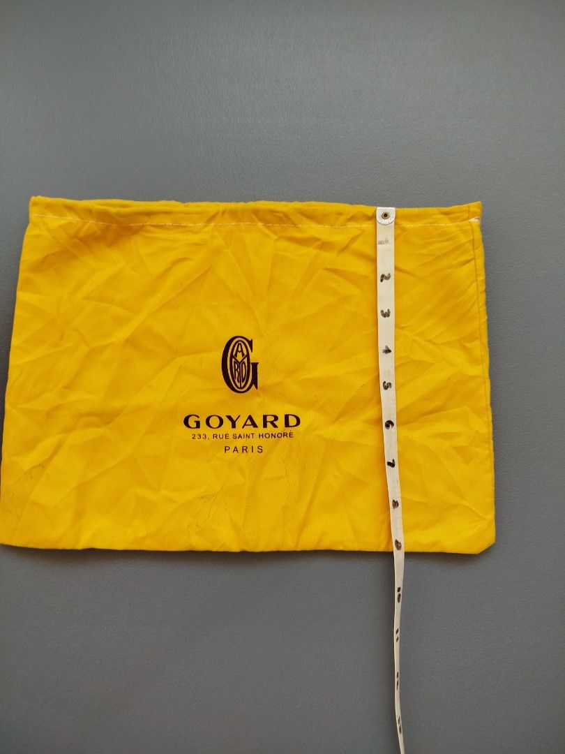 Goyard Dust Bag (Category: Luxury Bags & Wallets) located in Calamba. Submitted by merrymerida (Listing ID 1438914466, Image 2). Description: - Authentic Goyard dust bag - Color: Yellow - Shape: Rectangular - Features the Goyard logo - Condition: Shows some stains - Dimensions: Approximately 14 inches (height) x 9 inches (width).