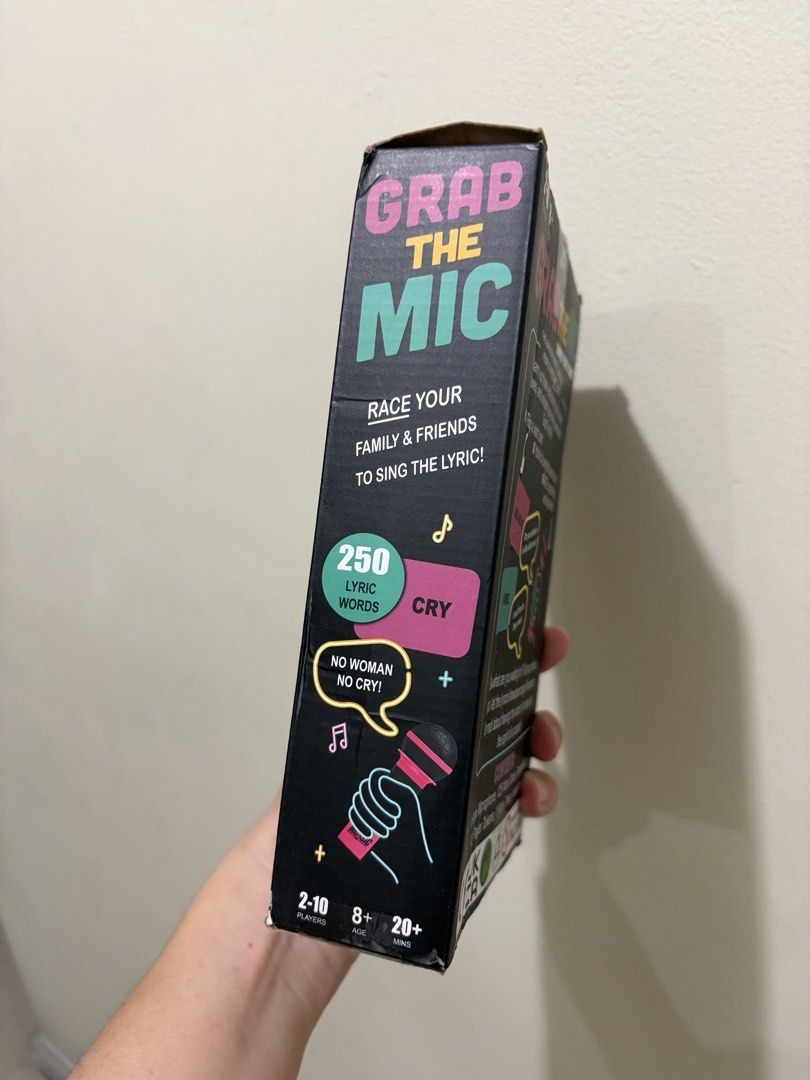 Grab The Mic Karaoke Party Game (Category: Microphones) located in Las Pinas. Submitted by bellagirl28 (Listing ID 1438920890, Image 3). Description: - Grab The Mic: The hilarious karaoke game! - Designed for people who can't sing! - Includes: Foam microphone, 125 word cards, 10 player tokens, and a mute token. - For 2-10 players. - Ages 8 and up. - Perfect for family parties and game nights! - Race your friends and family to sing the lyrics!.