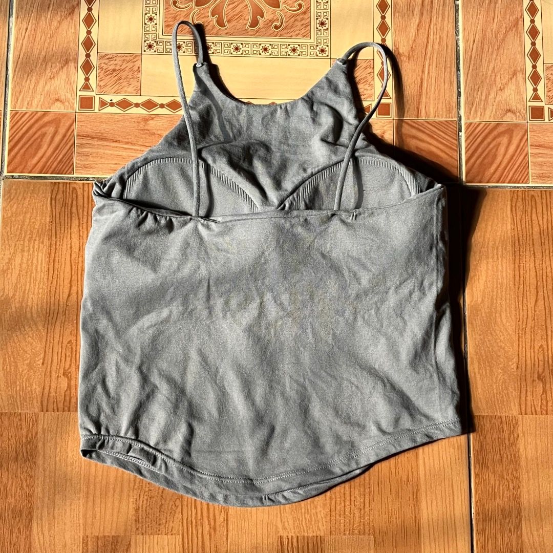 Gray Halter Tank Top (Category: Sleeveless) located in Caloocan City. Submitted by cabinetni_sam (Listing ID 1438993520, Image 2). Description: - Gray tank top - Scoop neckline - Thin straps - Unique back design - Soft, stretchy fabric - Great for layering or wearing alone - A versatile wardrobe essential.