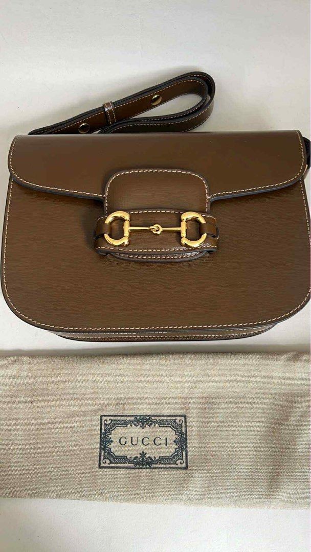 Gucci Horsebit 1955 Adjustable Bag (Category: Luxury Bags & Wallets) located in Hermosa. Submitted by bookwormhermosa (Listing ID 1438893952, Image 1). Description: - Gucci Horsebit 1955 Shoulder Bag - Brown leather exterior - Iconic gold-toned Horsebit detail - Flap closure - Detachable shoulder strap - Light-colored fabric lining - Includes dust bag with Gucci logo.