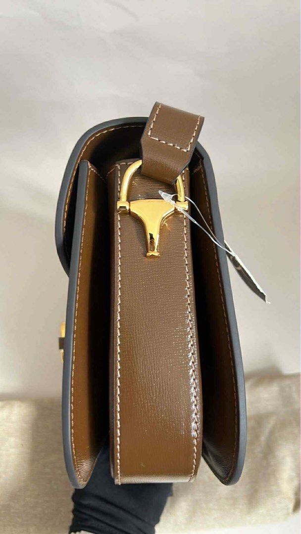 Gucci Horsebit 1955 Adjustable Bag (Category: Luxury Bags & Wallets) located in Hermosa. Submitted by bookwormhermosa (Listing ID 1438893952, Image 2). Description: - Gucci Horsebit 1955 Shoulder Bag - Brown leather exterior - Iconic gold-toned Horsebit detail - Flap closure - Detachable shoulder strap - Light-colored fabric lining - Includes dust bag with Gucci logo.
