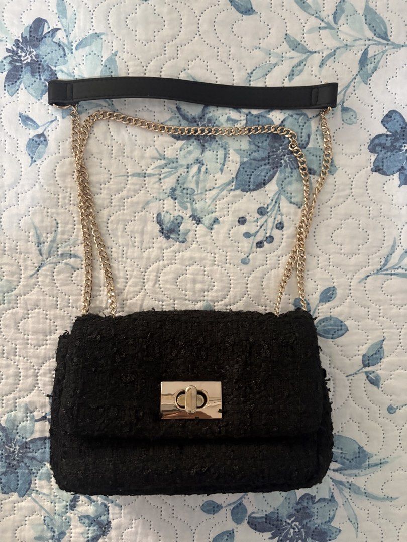 H&M Black Tweed Bag with Chain Strap (Category: Shoulder Bags) located in Antipolo. Submitted by theeditedcloset (Listing ID 1438924258, Image 1). Description: - Black tweed shoulder bag - Features a gold chain strap - Includes a detachable black strap for shoulder or hand carry - Flap closure with metallic clasp - Simple and elegant design - Suitable for various occasions.