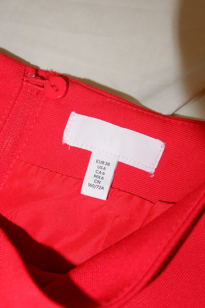H&M Red Skirt - Size 6 (Category: Skirts) located in Las Pinas. Submitted by ailasem (Listing ID 1439034258, Image 2). Description: - H&M red skirt - Size: EUR 36, US 6, CA 6, CN 160/72A - Classic, simple design - Zipper and button closure - Smooth, woven fabric - Adds a pop of color.