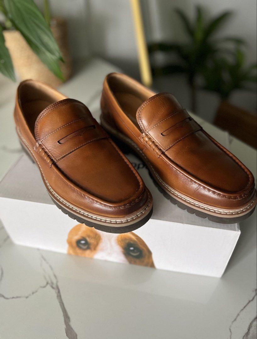 Hush Puppies Leather Loafers (Category: Casual Shoes) located in Pasay City. Submitted by eathanio (Listing ID 1438950472, Image 1). Description: - Genuine Hush Puppies leather loafers - Rich brown color - Classic penny loafer design - Features OrthoHeal technology for comfort - Sturdy sole - Hush Puppies logo visible - Comes with original box.