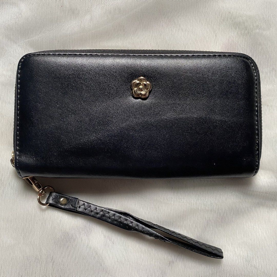 Japan Black Wallet with Wristlet (Category: Wallets & Card holders) located in Makati City. Submitted by imsuli (Listing ID 1438929919, Image 1). Description: ෆ Negotiable ෆ Black zippered wallet ෆ Gold-colored flower emblem ෆ Multiple card slots ෆ Zippered compartment ෆ Smooth material ෆ Wrist strap included.