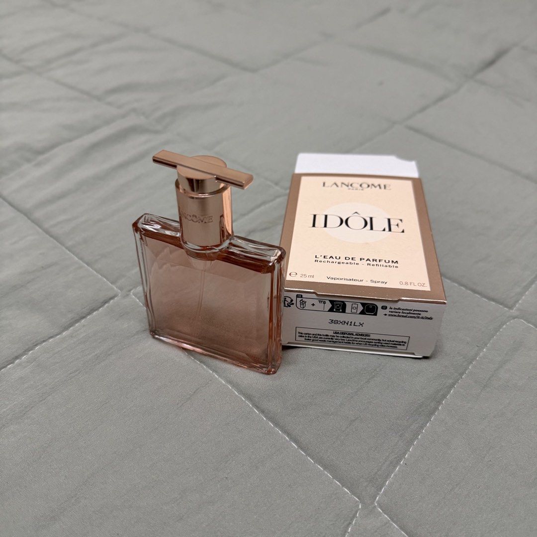 Lancome Idole L'Eau de Parfum 25ml (Category: Fragrance & Deodorants) located in Makati City. Submitted by forcedtobenta (Listing ID 1438988840, Image 1). Description: - Authentic Lancome Idole L'Eau de Parfum - 25ml bottle - Includes original box - Box indicates it's rechargeable and refillable - Sleek, rectangular bottle with rose gold cap - Perfect for fresh, floral fragrance lovers 2-3 sprays lang sure inask ko kung she likes it hindi daw but