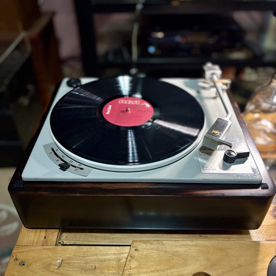 Lenco Model L70 Turntable (Category: Other Audio Equipment) located in Marikina City. Submitted by automart (Listing ID 1438928788, Image 1). Description: - Vintage Lenco Model L70 Turntable - Features a classic wooden base - Includes a clear dust cover - Silver-colored top with speed and play/off controls - Silver tonearm - Made in Switzerland.