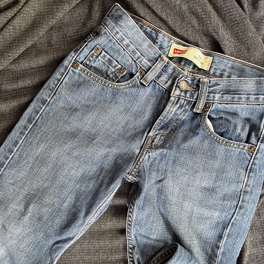Levi's 550 Relaxed Fit Jeans (Category: Babies & Kids Fashion) located in Dumalinao. Submitted by sweeteapie (Listing ID 1438903488, Image 2). Description: Levi's 550 Relaxed Fit jeans in a light blue wash. Features a classic five-pocket design with a button and zipper closure. The Levi's red tab is visible on the back pocket. The jeans have a relaxed fit and are size 24x32. Price is negotiable.