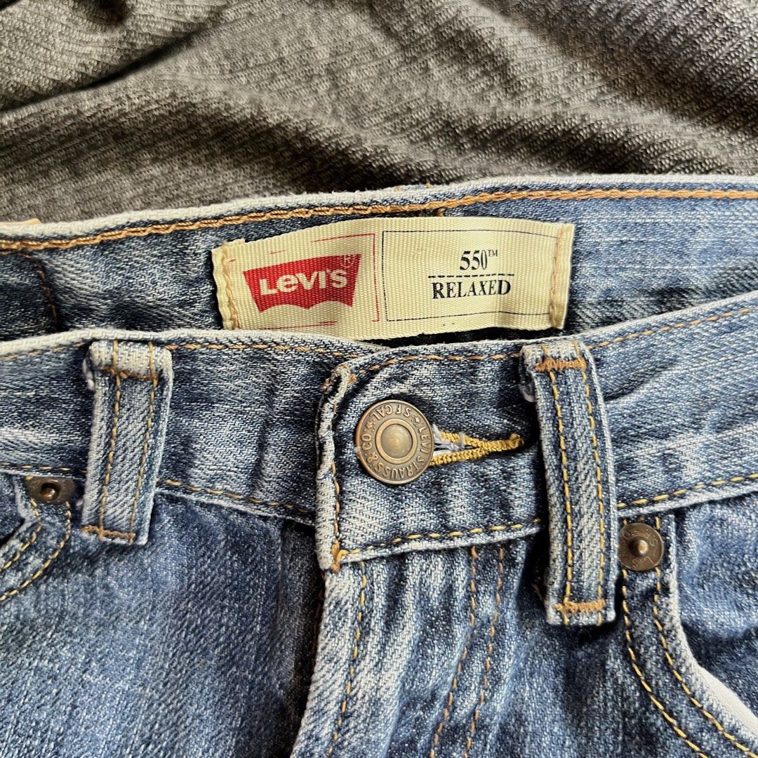Levi's 550 Relaxed Fit Jeans (Category: Babies & Kids Fashion) located in Dumalinao. Submitted by sweeteapie (Listing ID 1438903488, Image 3). Description: Levi's 550 Relaxed Fit jeans in a light blue wash. Features a classic five-pocket design with a button and zipper closure. The Levi's red tab is visible on the back pocket. The jeans have a relaxed fit and are size 24x32. Price is negotiable.