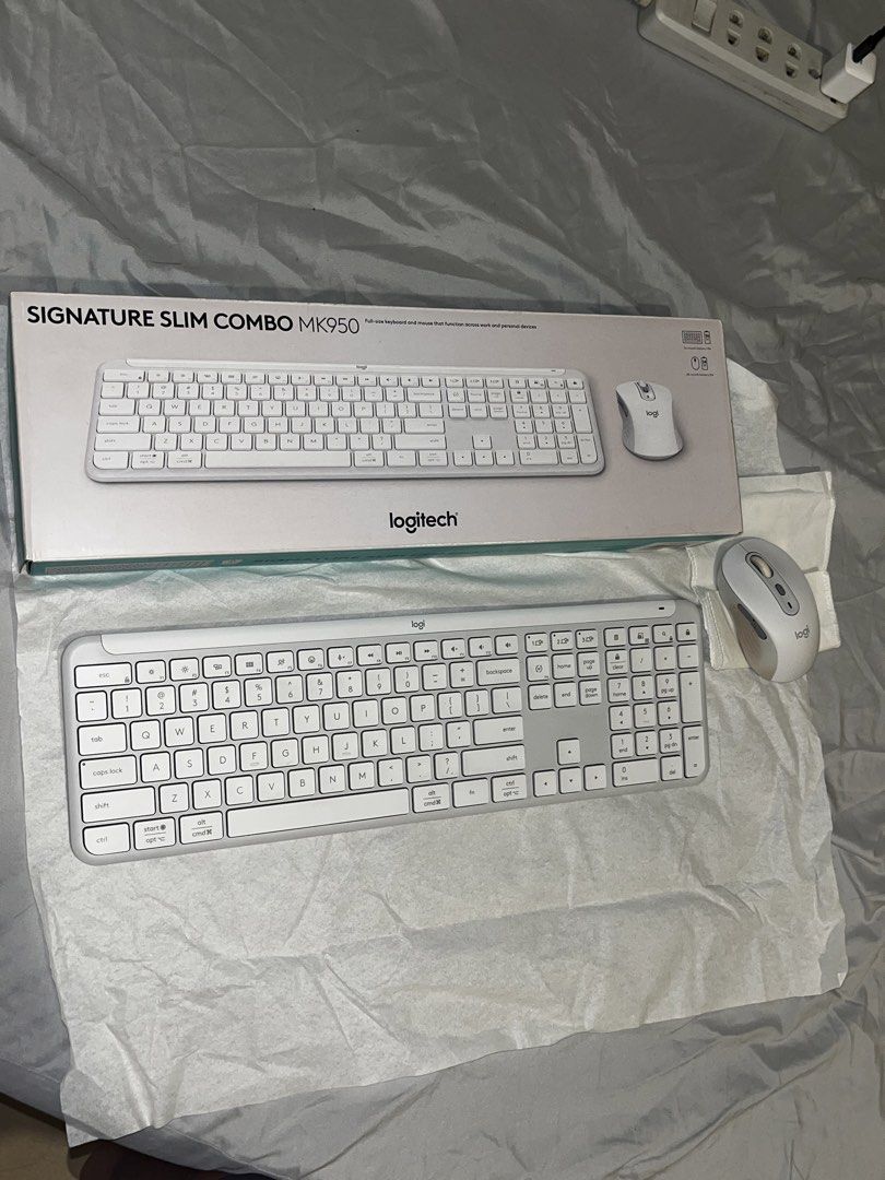 Logitech Signature Slim Combo MK950 Wireless Mouse and Keyboard (Category: Computer Keyboard) located in Makati City. Submitted by gabrayco (Listing ID 1438999547, Image 1). Description: - Logitech Signature Slim Combo MK950 - White keyboard (full layout) and mouse - Includes original box - DataBlitz price tag visible -signs of usage.