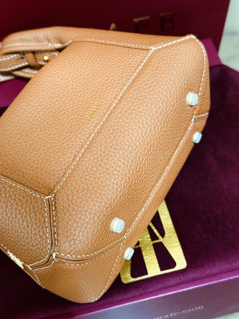 RUSH! Lomafe Mini Fien in Pecan (Category: Cross-body Bags) located in Quezon City. Submitted by finderskeepersbya_ (Listing ID 1438955915, Image 2). Description: Used once Bought last April 11, 2026 in their physical store in QC Inclusions: Dust bag, box, paper bag, receipt Bottom studs still has its covers RFS: Too small for me Note: Willing to trade and add for Lomafe Velisse in Cabernet color. Price is slightly negotiable :).