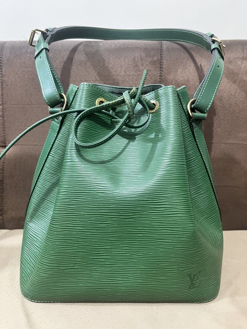 Louis Vuitton Epi Leather Bucket Bag (Category: Luxury Bags & Wallets) located in Orani. Submitted by kevskle08 (Listing ID 1439032444, Image 1). Description: - Authentic Louis Vuitton bucket bag. - Crafted from durable Epi leather. - Features a secure drawstring closure. - Includes a top handle and an adjustable shoulder strap for versatile carrying options. - Elegant gold-tone hardware. - Made in France. -with original dust bag.