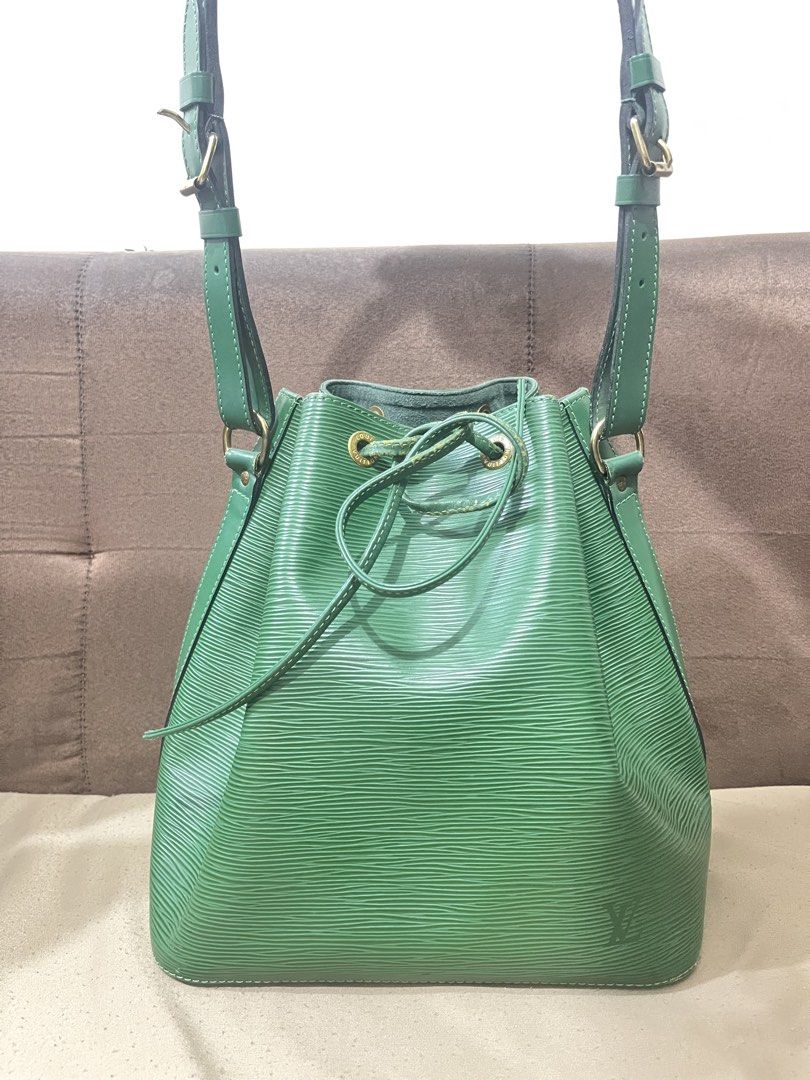 Louis Vuitton Epi Leather Bucket Bag (Category: Luxury Bags & Wallets) located in Orani. Submitted by kevskle08 (Listing ID 1439032444, Image 2). Description: - Authentic Louis Vuitton bucket bag. - Crafted from durable Epi leather. - Features a secure drawstring closure. - Includes a top handle and an adjustable shoulder strap for versatile carrying options. - Elegant gold-tone hardware. - Made in France. -with original dust bag.