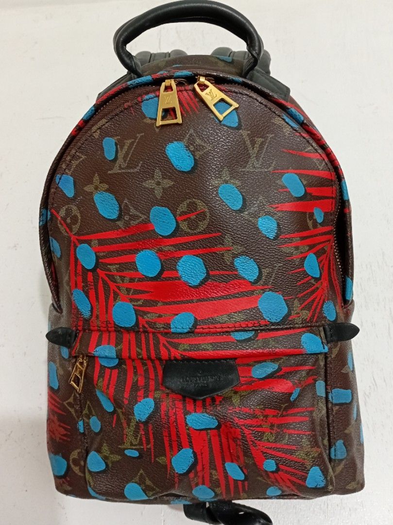 LV Mini Backpack (Category: Luxury Bags & Wallets) located in Navotas City. Submitted by ms.soulana (Listing ID 1438984428, Image 2). Description: PreOwned Lightly Used Louis Vuitton Palm Springs Mini Backpack - Eye-catching pattern with red and blue accents - Black leather straps and top handle - Secure zip closure - Convenient front pocket - Elegant gold-toned hardware 🖤Coded (NGA ) gupit un Leather tag na may code Good Condition 9/10 Model on