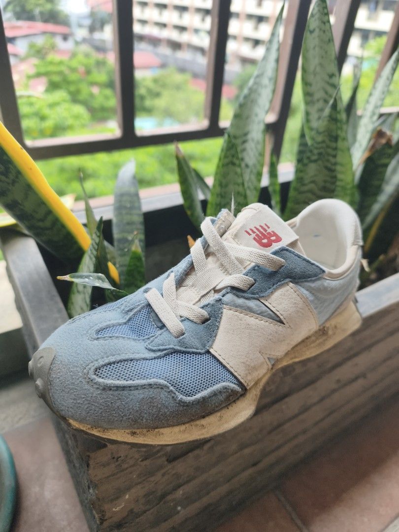 New Balance 327 Sneakers (Category: Sneakers) located in Quezon City. Submitted by tajima (Listing ID 1438929923, Image 2). Description: - New Balance 327 sneakers - Color: Blue and beige - Features the iconic New Balance logo - Gray sole with textured pattern - Size: EU 33.5/US 2.