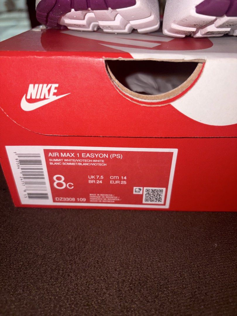 Nike Air Max 1 Easyon (PS) - 8C (Category: Babies & Kids Fashion) located in San Pedro. Submitted by AuthenticBrandedItems (Listing ID 1438968050, Image 3). Description: - Nike Air Max 1 Easyon (PS) sneakers - Color: White and Purple - Size: 8C - Easy-on design with hook-and-loop strap - Features Nike logo on side and tongue - Includes original box with Nike logo.