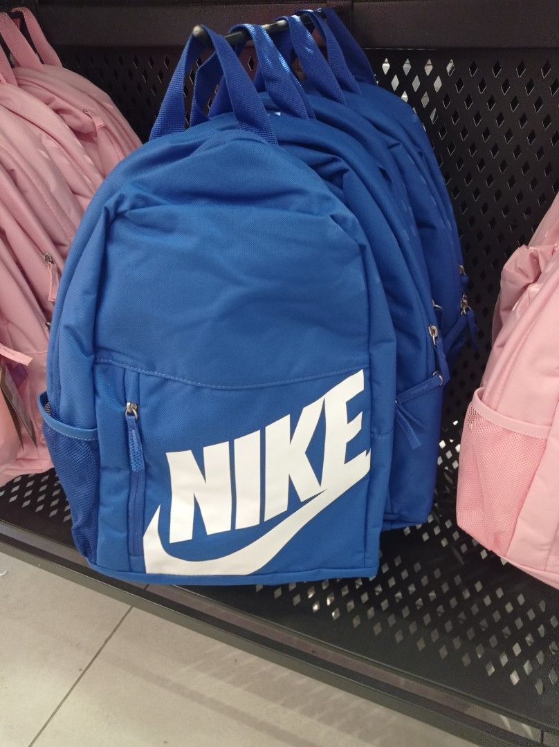 Nike Backpack - Blue Grade School with free Pencil Case (Category: Backpacks) located in Manila. Submitted by kamirphili04754 (Listing ID 1438981473, Image 1). Description: - Nike backpack in a striking blue color. - Features the classic Nike logo. - Includes a spacious main compartment. - Has a front zippered pocket for easy access. - Equipped with side mesh pockets for water bottles. - Features a small zippered pouch on the back. - 20L capacity