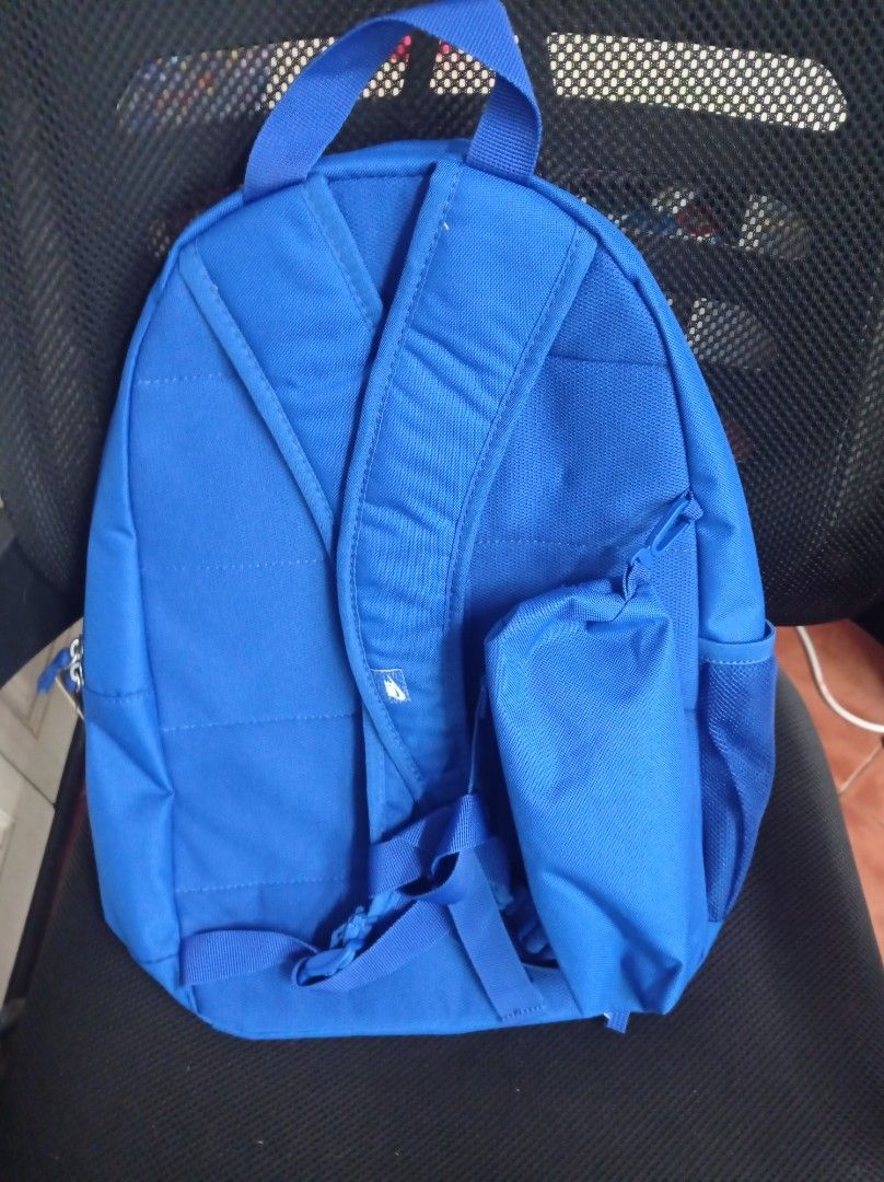 Nike Backpack - Blue Grade School with free Pencil Case (Category: Backpacks) located in Manila. Submitted by kamirphili04754 (Listing ID 1438981473, Image 3). Description: - Nike backpack in a striking blue color. - Features the classic Nike logo. - Includes a spacious main compartment. - Has a front zippered pocket for easy access. - Equipped with side mesh pockets for water bottles. - Features a small zippered pouch on the back. - 20L capacity