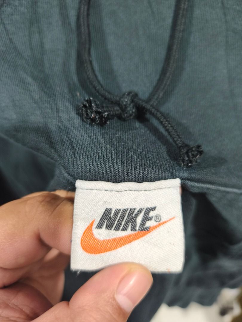 Nike Big Swoosh Hoodie (Category: Coats, Jackets and Outerwear) located in Davao. Submitted by thethriftproject082 (Listing ID 1438974523, Image 3). Description: NIKE BACKSWOOSH HOODIE 📍Size on Tag: M 📍Dimensions: 24 X 24 📍Price: 450 - Large white swoosh design on the back - Drawstring hood and front pocket - Size M - Made in Indonesia - Relaxed fit.