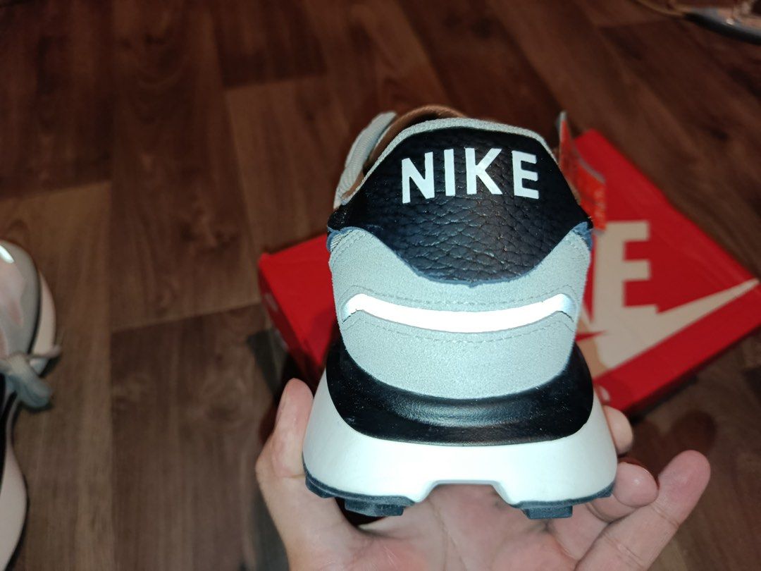 Nike Phoenix Waffle Grey/Pink Sneakers (Category: Sneakers) located in Bacolod City. Submitted by swagspot (Listing ID 1438963424, Image 2). Description: - Nike Phoenix Waffle sneakers - Color: Grey and pink - Nike swoosh: Black - Sole: White - Size: UK 9 / BR 42 / EUR 44 / US 10 - Includes original box - Reflective details on sides and heel.